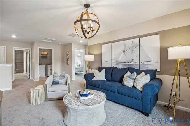 a living room with furniture a rug and a large window