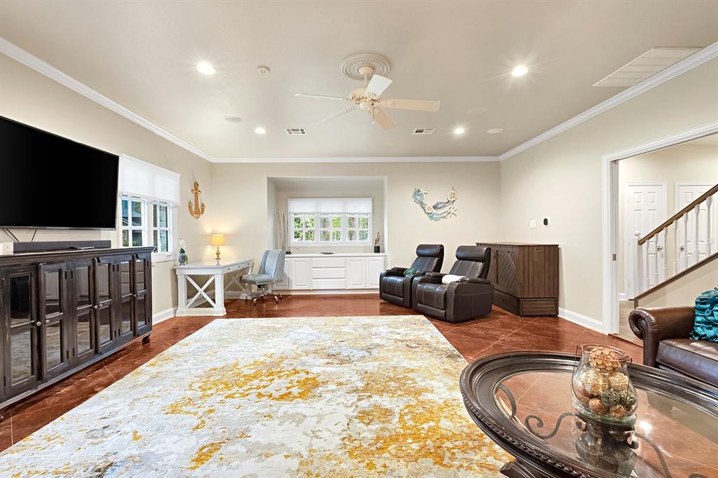 103 Glenn Road Mabank, TX 75156 - Photo 20 of 38 a living room with furniture and a flat screen tv