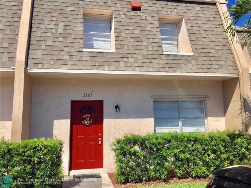 3321 Quail Close Pompano Beach, FL 33064 - Photo 1 of 9 a view of a brick house with a small yard