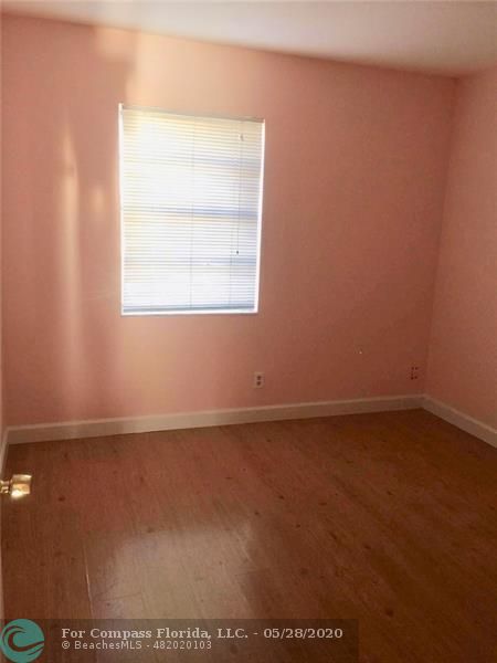 3321 Quail Close Pompano Beach, FL 33064 - Photo 5 of 9 an empty room with a window