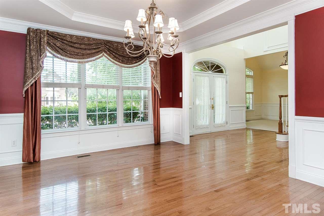 9001 Winged Thistle Court Raleigh, NC 27617 - Photo 13 of 25 a view of a room with wooden floor chandelier and livingroom