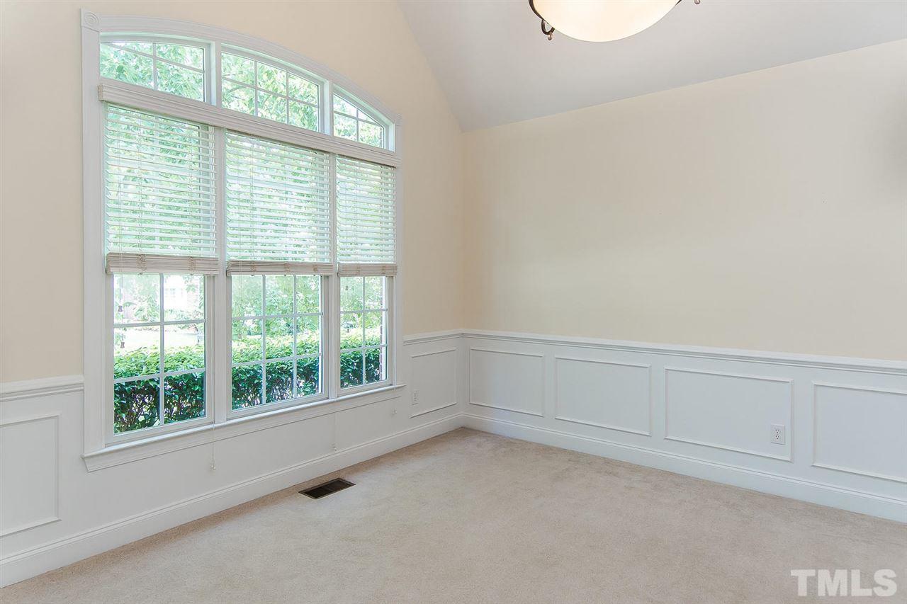 9001 Winged Thistle Court Raleigh, NC 27617 - Photo 14 of 25 an empty room with a window