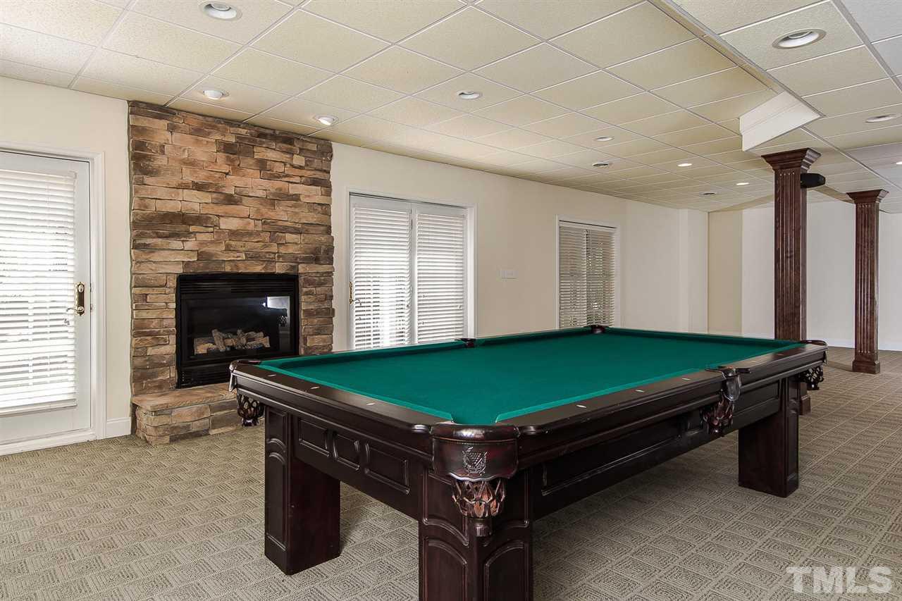 9001 Winged Thistle Court Raleigh, NC 27617 - Photo 21 of 25 a room with pool table and windows
