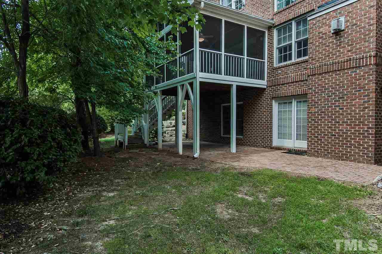 9001 Winged Thistle Court Raleigh, NC 27617 - Photo 23 of 25 a view of an house with backyard space and balcony