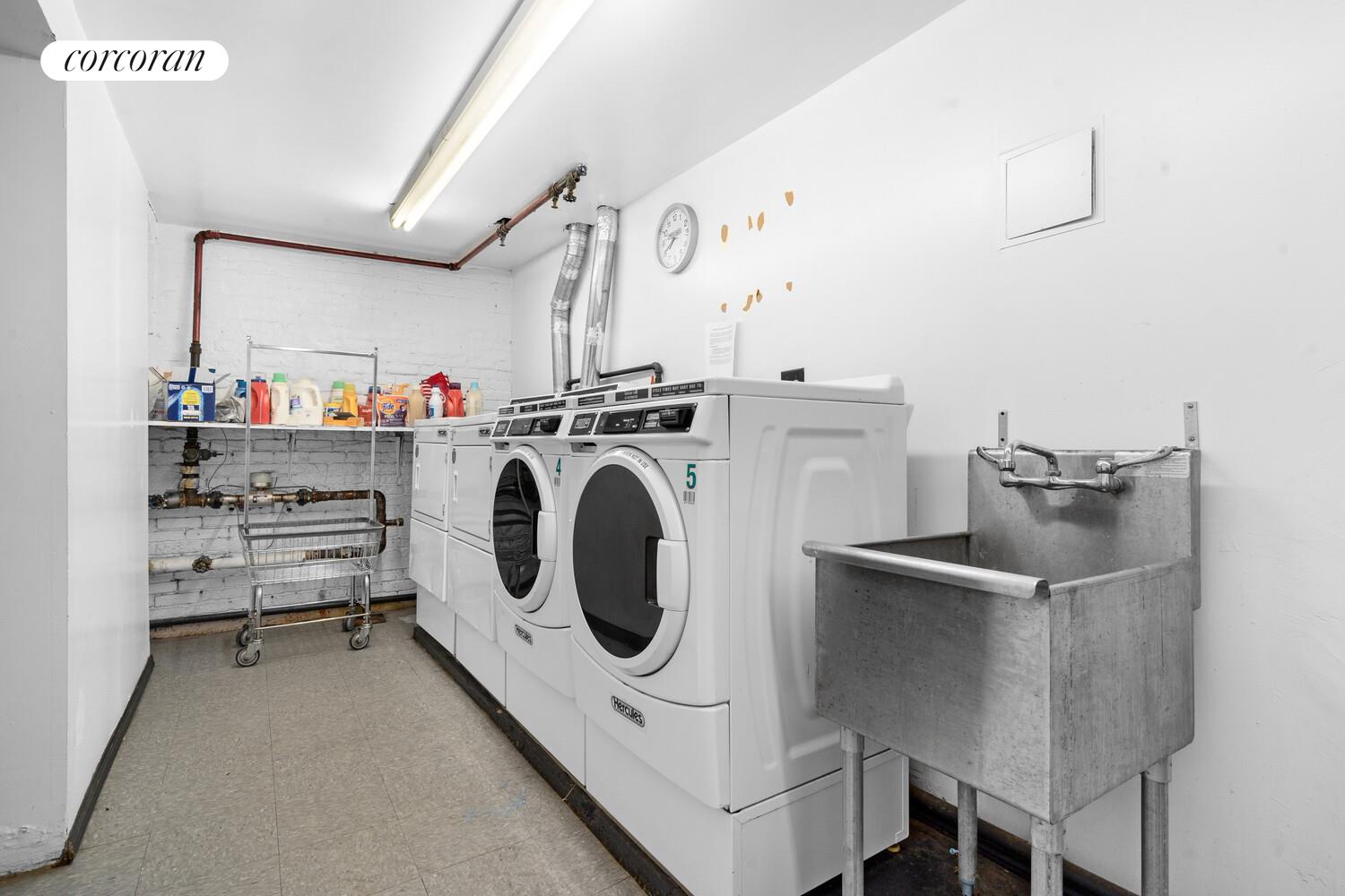 213 Eastern Parkway, Unit 3 Brooklyn, NY 11238 - Photo 7 of 8 a utility room with cabinets dryer and washer