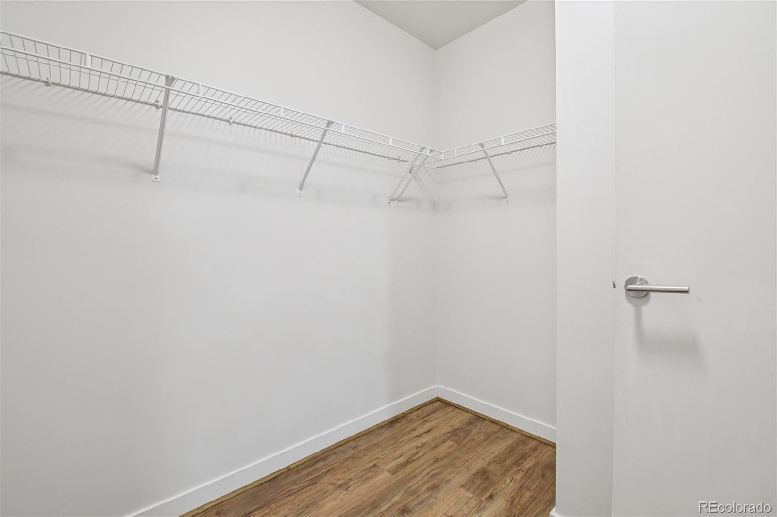 410 Acoma Street, Unit 206 Denver, CO 80204 - Photo 20 of 37 a view of a room with racks on the wall