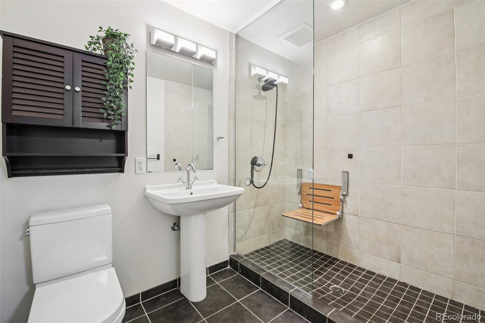 410 Acoma Street, Unit 206 Denver, CO 80204 - Photo 21 of 37 a bathroom with a sink toilet and shower