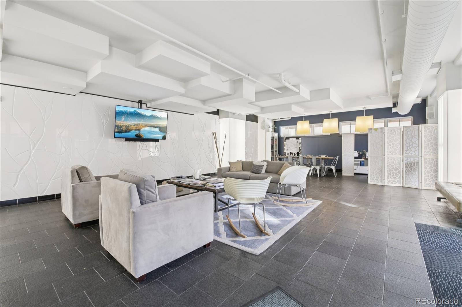 410 Acoma Street, Unit 206 Denver, CO 80204 - Photo 22 of 37 a living room with couches and kitchen view