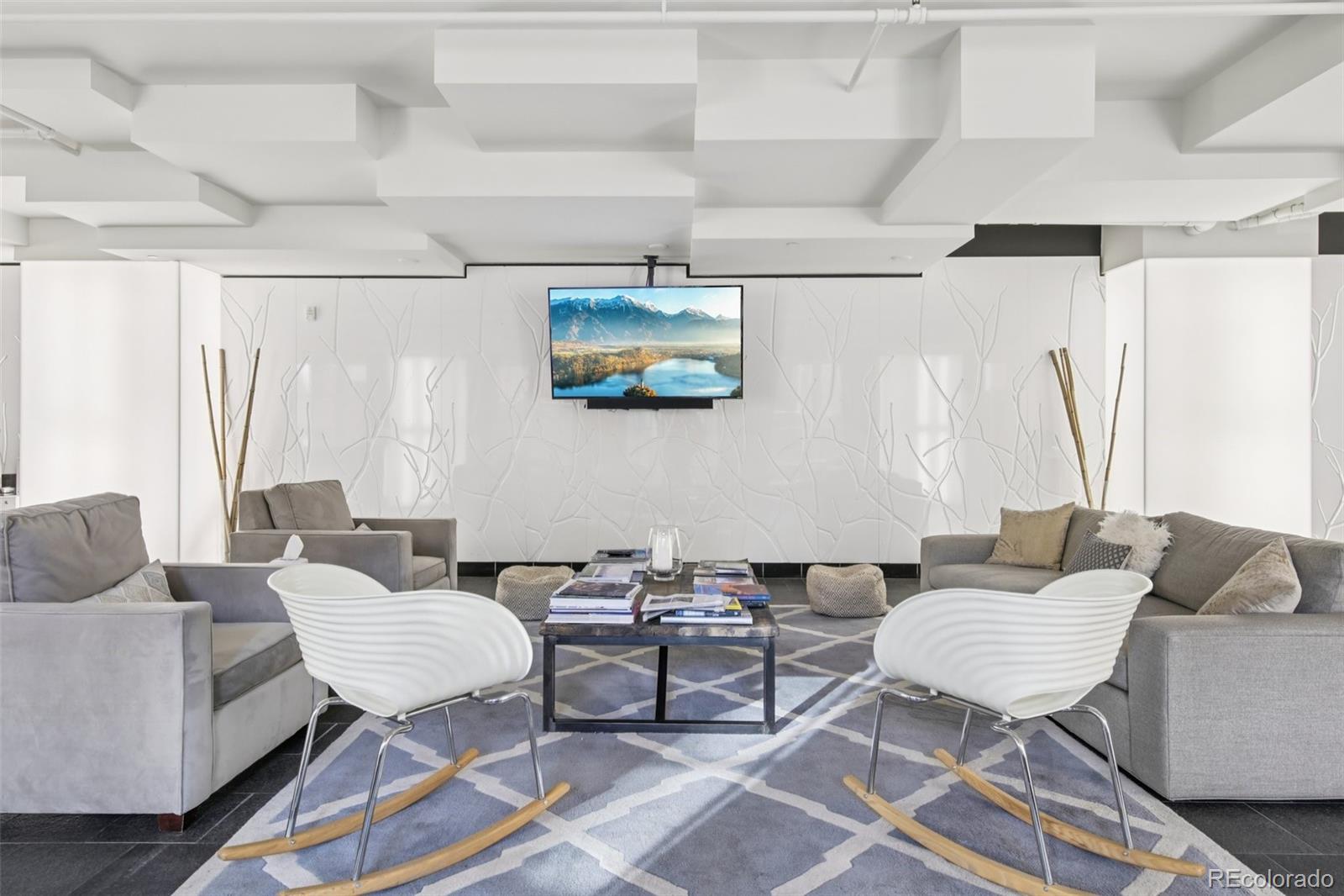 410 Acoma Street, Unit 206 Denver, CO 80204 - Photo 23 of 37 a living room with furniture and a chair