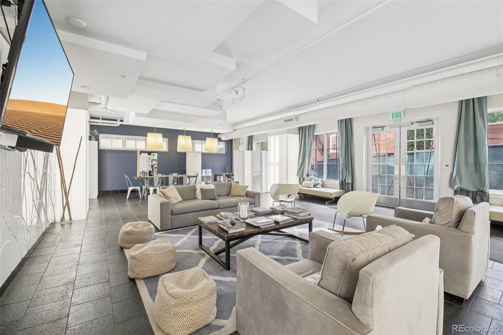 410 Acoma Street, Unit 206 Denver, CO 80204 - Photo 24 of 37 a living room with furniture and a large window