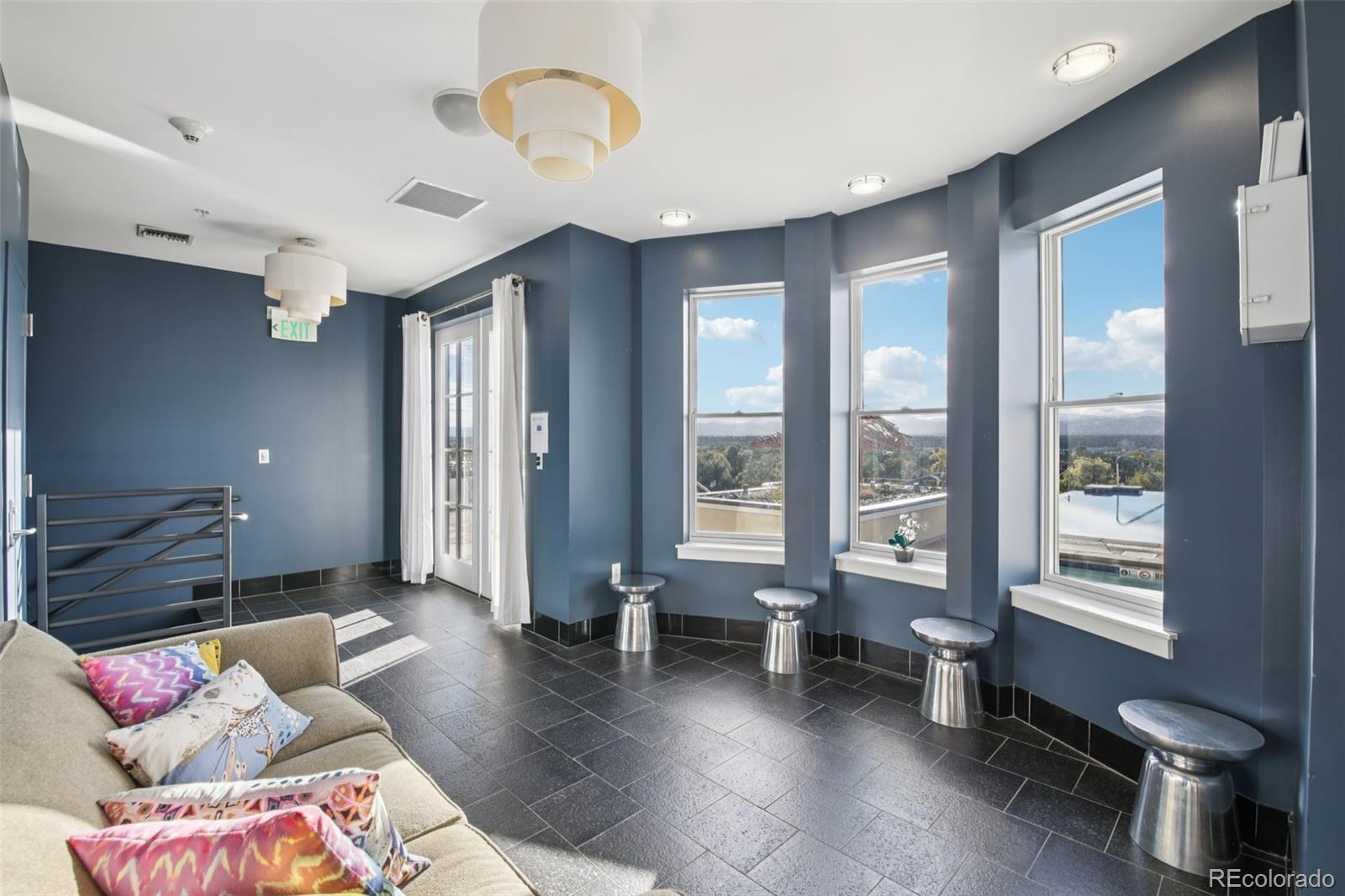410 Acoma Street, Unit 206 Denver, CO 80204 - Photo 27 of 37 a living room with furniture and a window