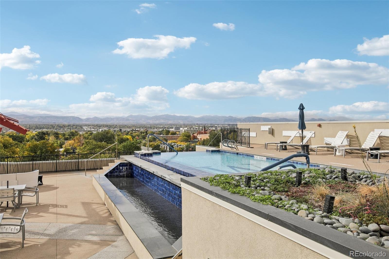 410 Acoma Street, Unit 206 Denver, CO 80204 - Photo 30 of 37 a view of a swimming pool and a terrace