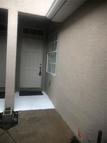 a view of a livingroom with furniture and entryway