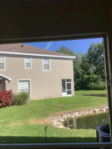 a view of a back yard from a balcony