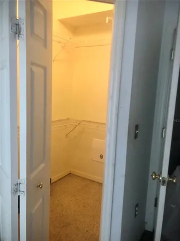 a white toilet sitting next to a bath tub and a shower