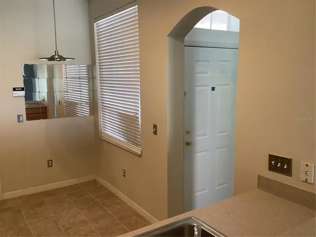 a kitchen with a refrigerator stove and microwave