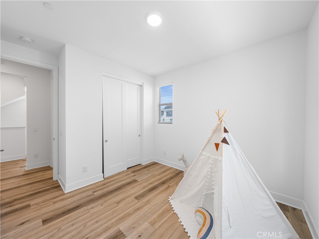 191 Lynx Irvine, CA 92618 - Photo 11 of 24 a view of a livingroom with wooden floor and staircase