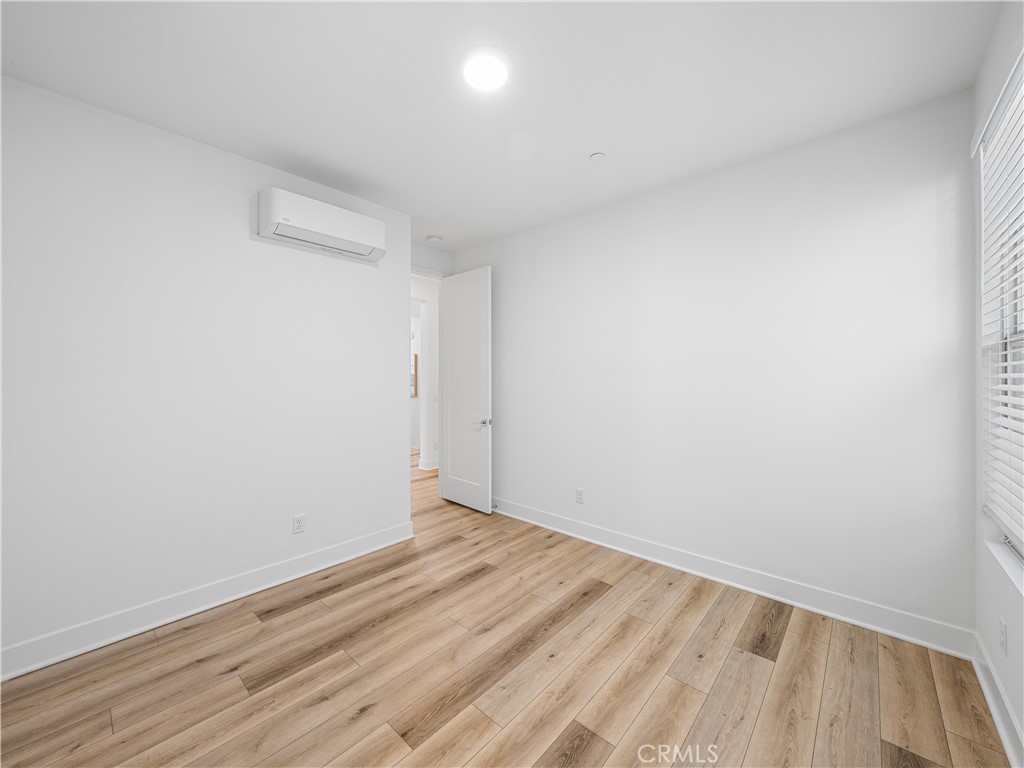 191 Lynx Irvine, CA 92618 - Photo 14 of 24 a view of room with wooden floor