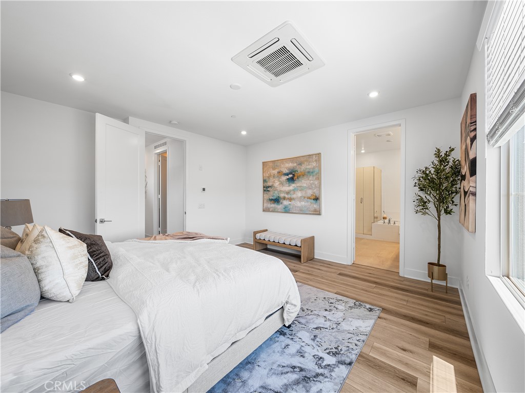 191 Lynx Irvine, CA 92618 - Photo 16 of 24 a spacious bedroom with a large bed and a couch