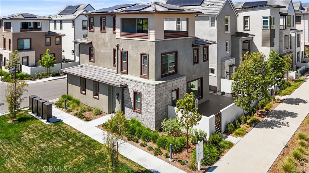 191 Lynx Irvine, CA 92618 - Photo 2 of 24 a aerial view of a house with a yard and potted plants