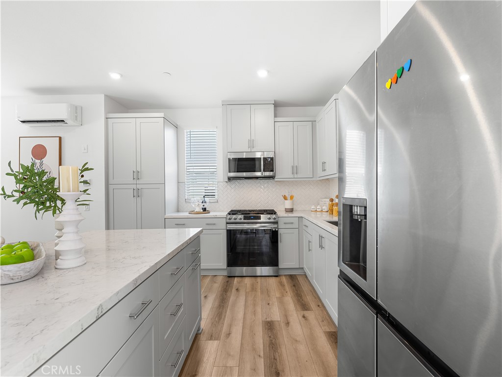 191 Lynx Irvine, CA 92618 - Photo 5 of 24 a kitchen with a sink stainless steel appliances and cabinets