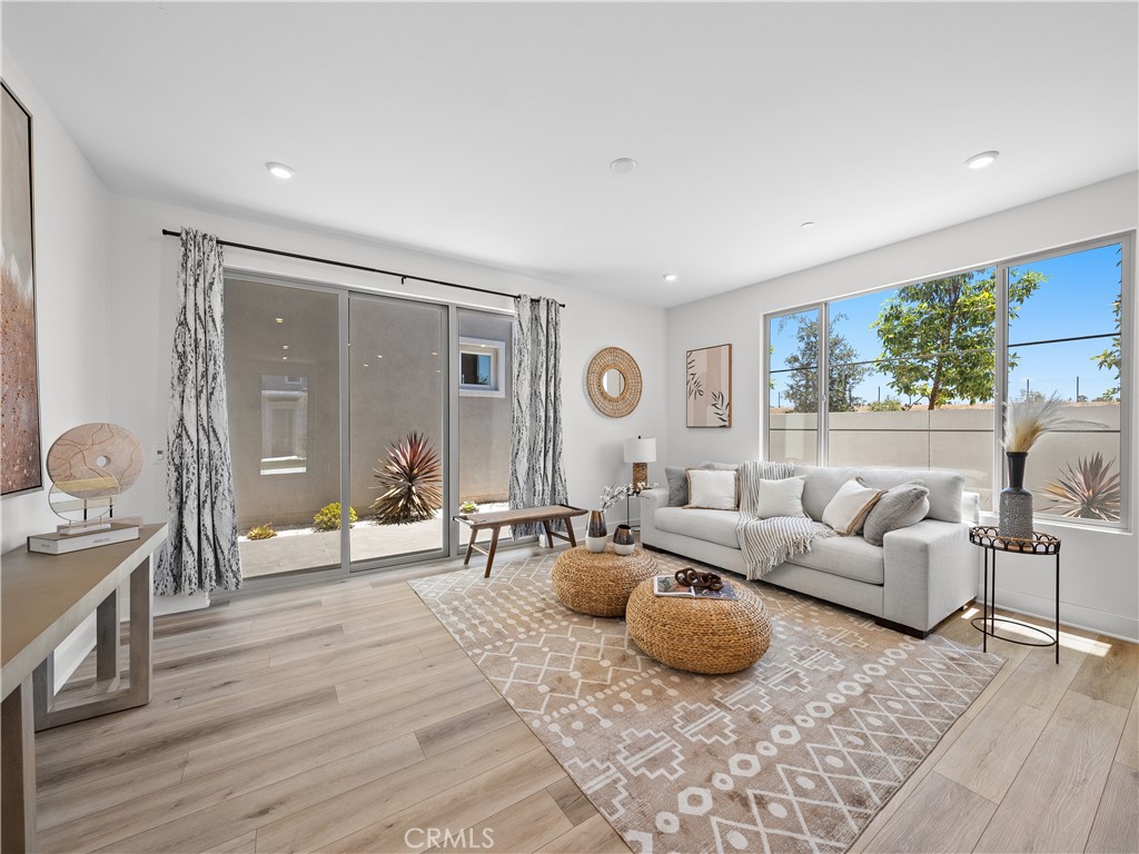 191 Lynx Irvine, CA 92618 - Photo 7 of 24 a living room with furniture and a large window