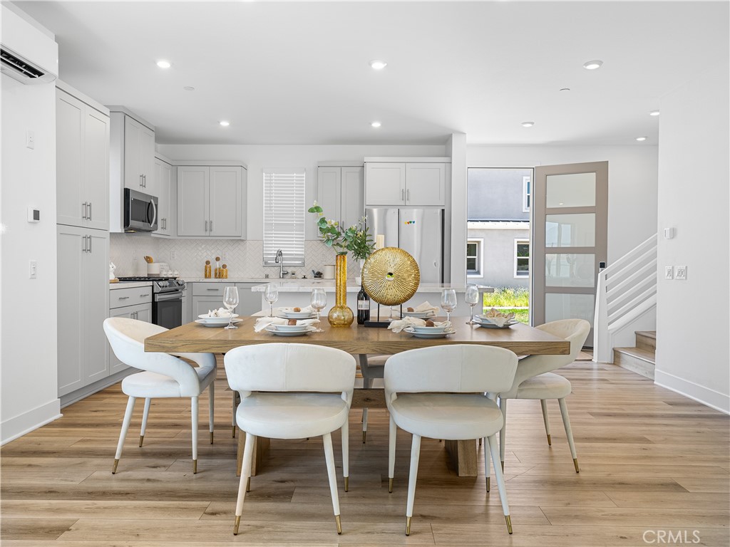 191 Lynx Irvine, CA 92618 - Photo 8 of 24 a view of a dining room with furniture and wooden floor