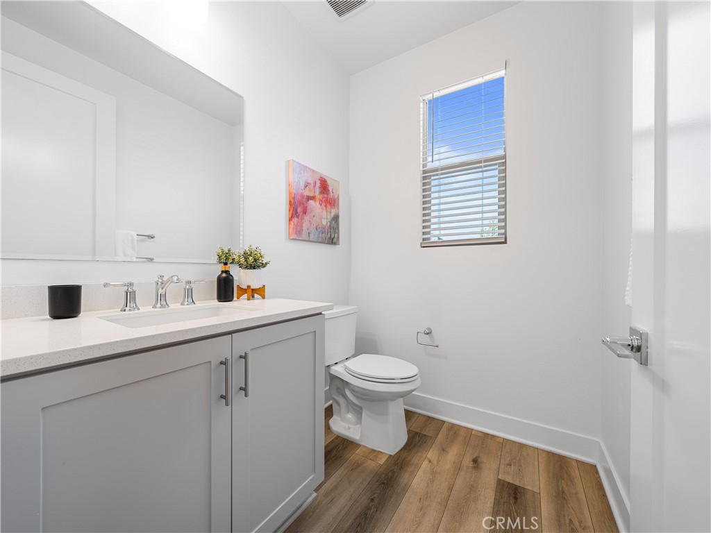 191 Lynx Irvine, CA 92618 - Photo 9 of 24 a bathroom with a sink toilet and vanity