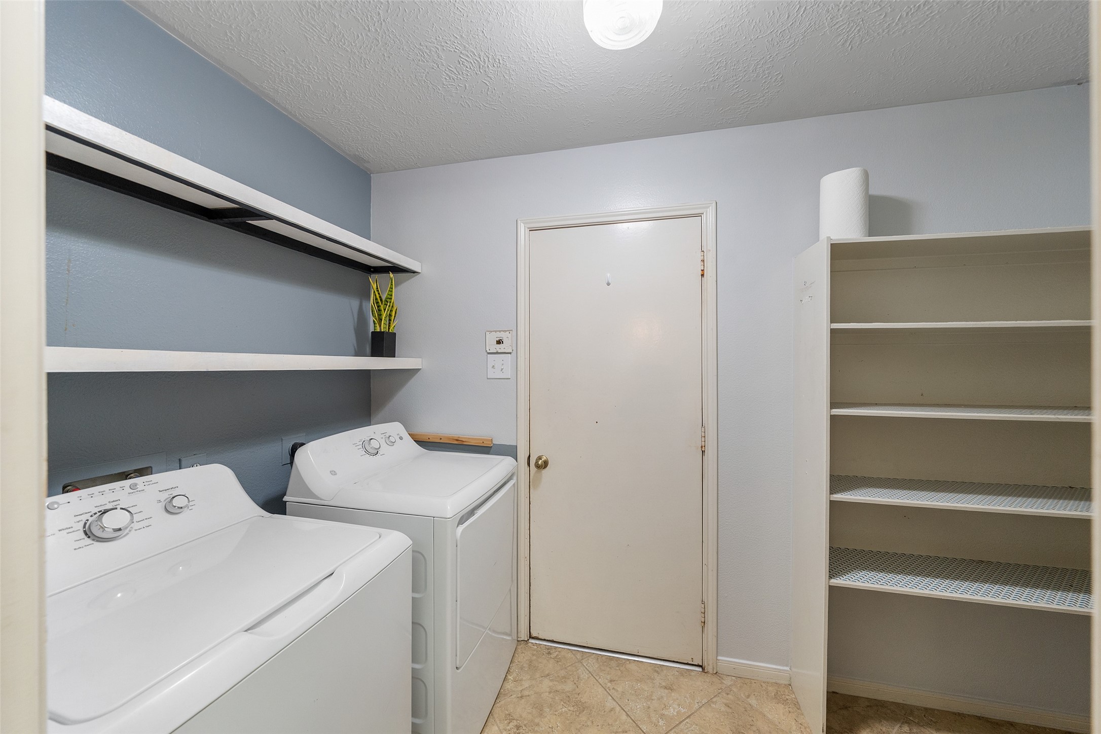 19718 Teller Boulevard Spring, TX 77388 - Photo 31 of 47 a utility room with dryer and washer