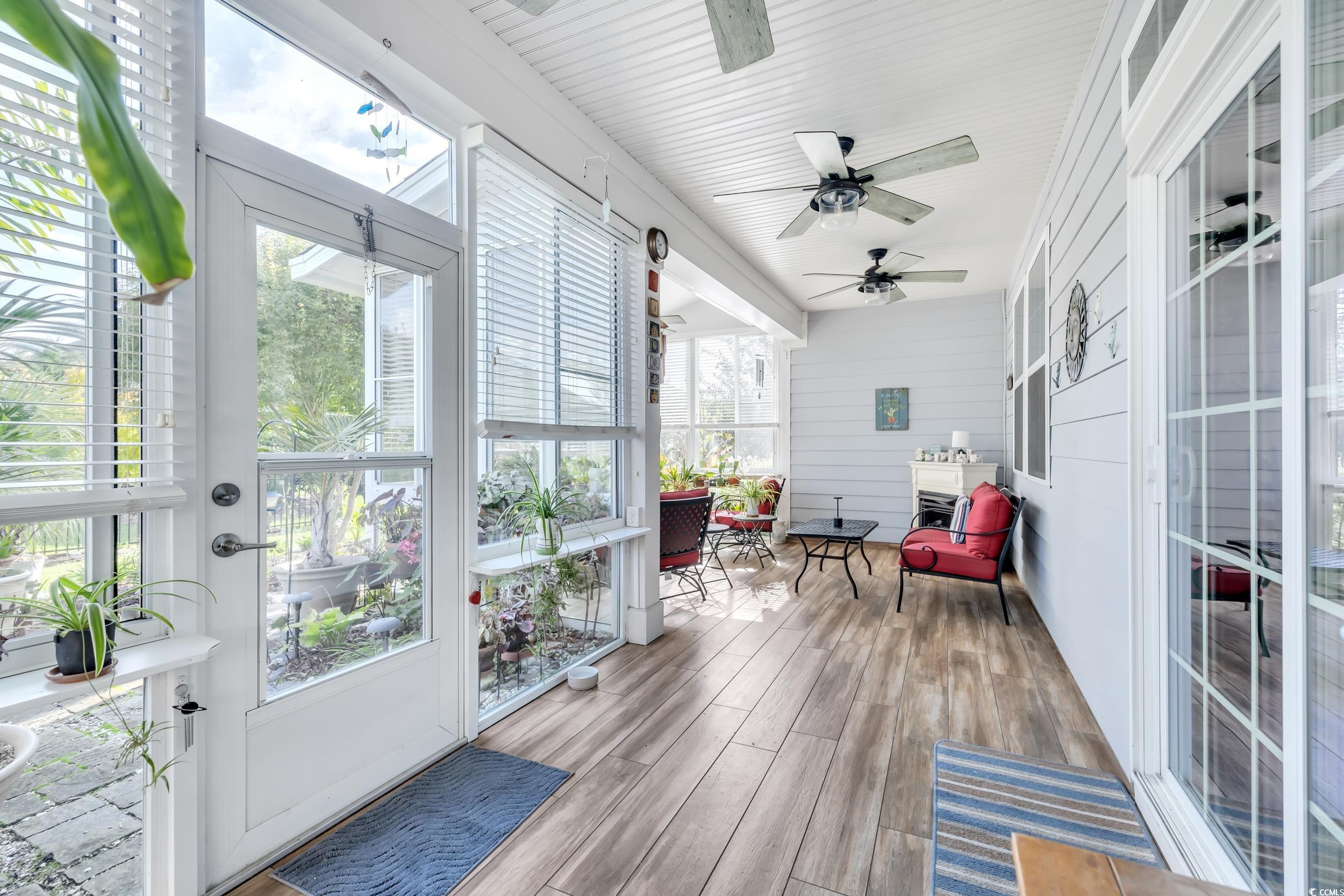 1464 Culbertson Avenue Myrtle Beach, SC 29577 - Photo 13 of 40 Sunroom / solarium featuring plenty of natural light, wood finished floors, and a ceiling fan