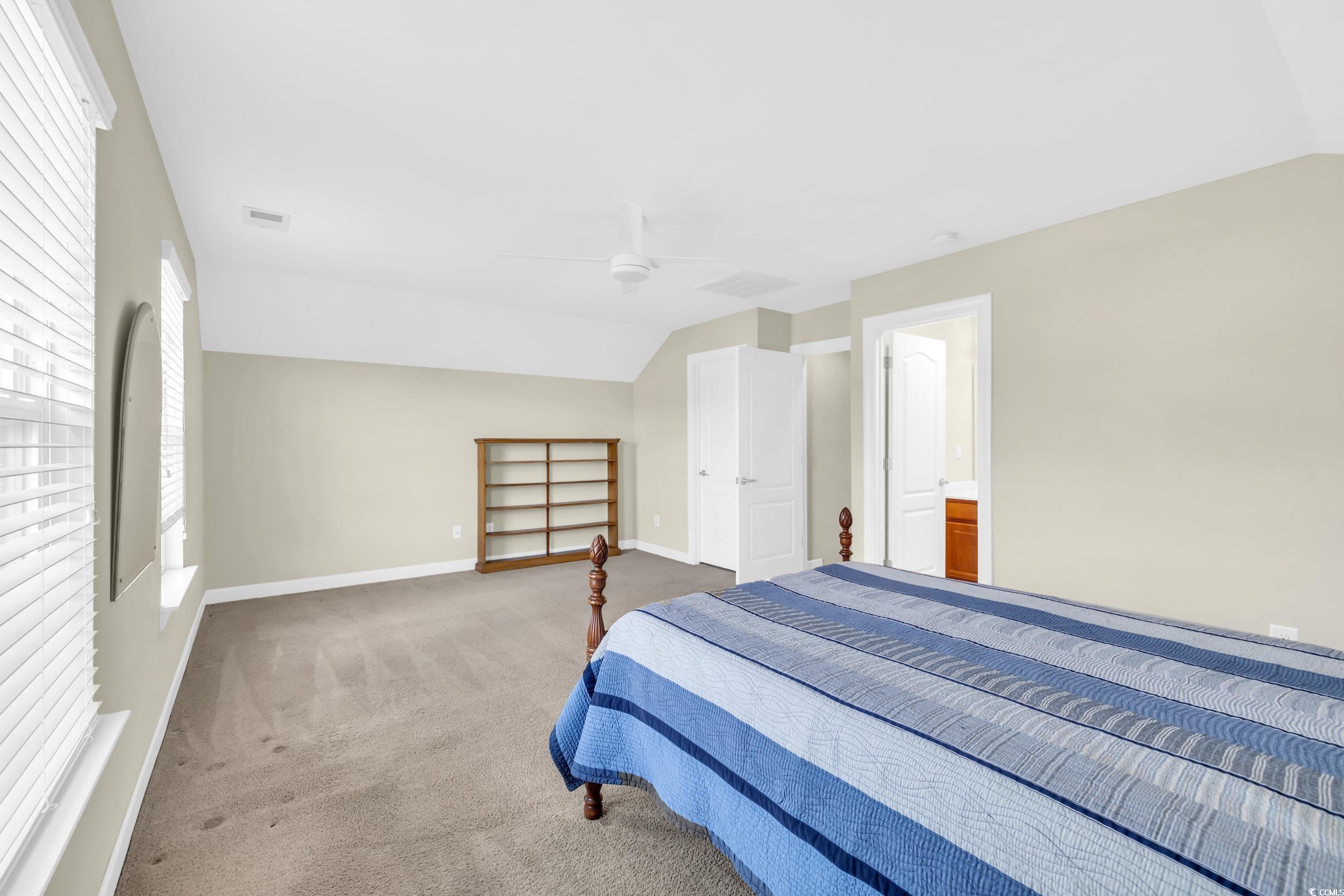 1464 Culbertson Avenue Myrtle Beach, SC 29577 - Photo 27 of 40 Bedroom featuring vaulted ceiling, carpet, and a ceiling fan
