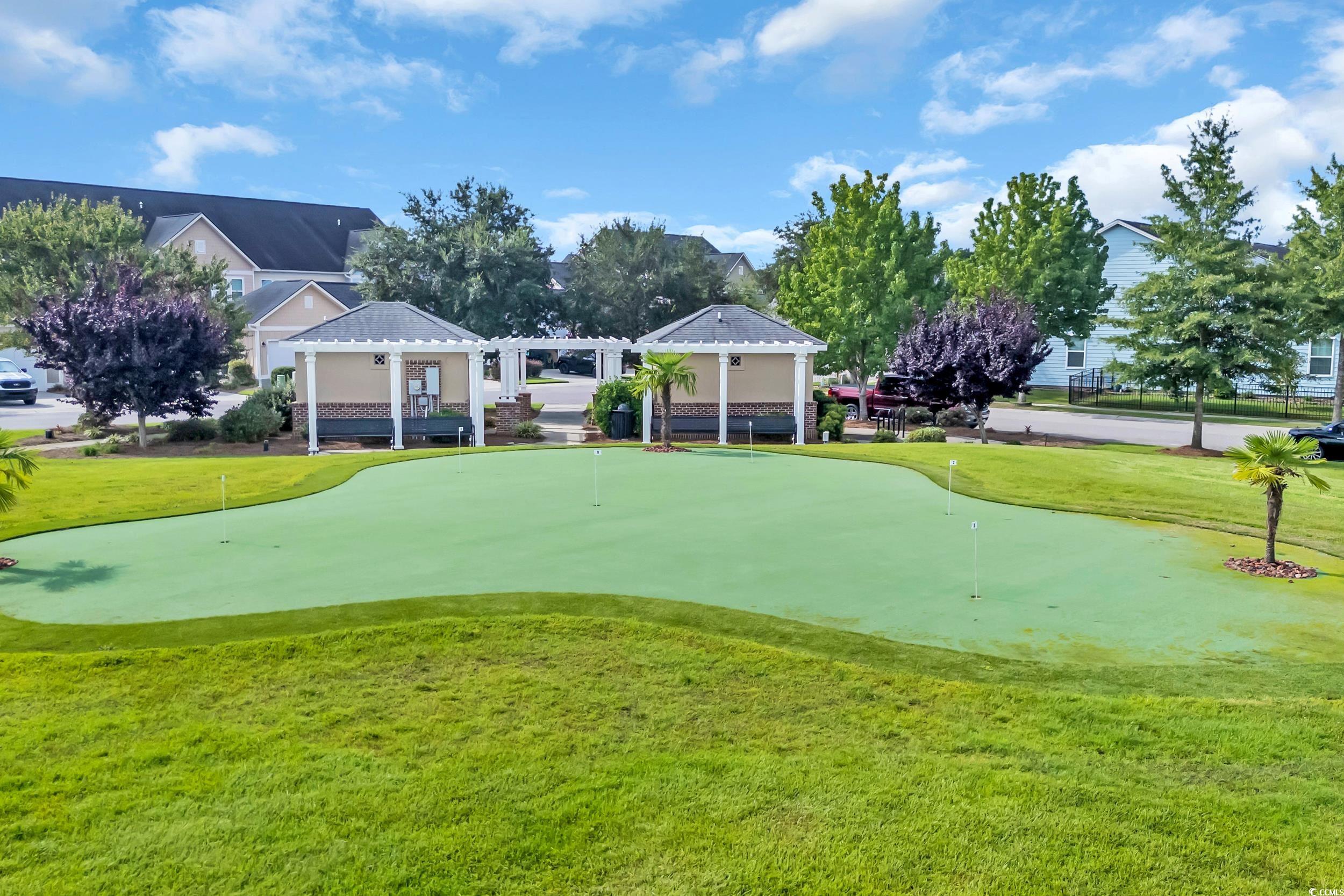 1464 Culbertson Avenue Myrtle Beach, SC 29577 - Photo 37 of 40 View of home's community with a lawn, a putting green, and golf course view