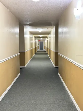 a view of a room with a ceiling fan