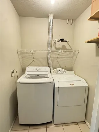 an empty room with window and mirror