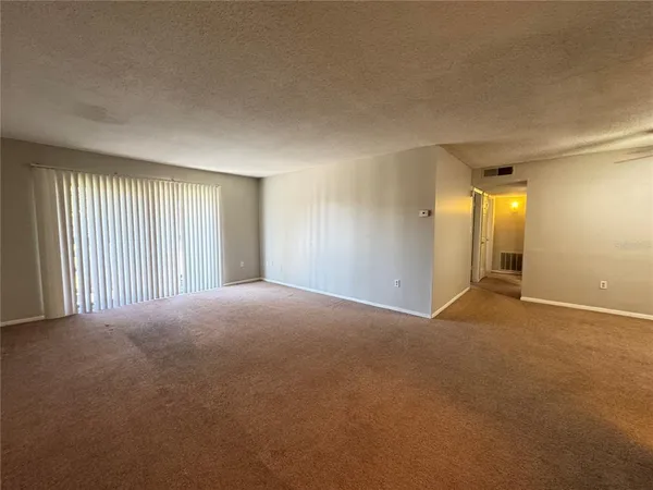 a kitchen with stainless steel appliances a stove a sink a microwave and a refrigerator