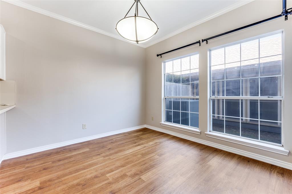 148 Cobblestone Row Denton, TX 76207 - Photo 11 of 37 an empty room with wooden floor and windows