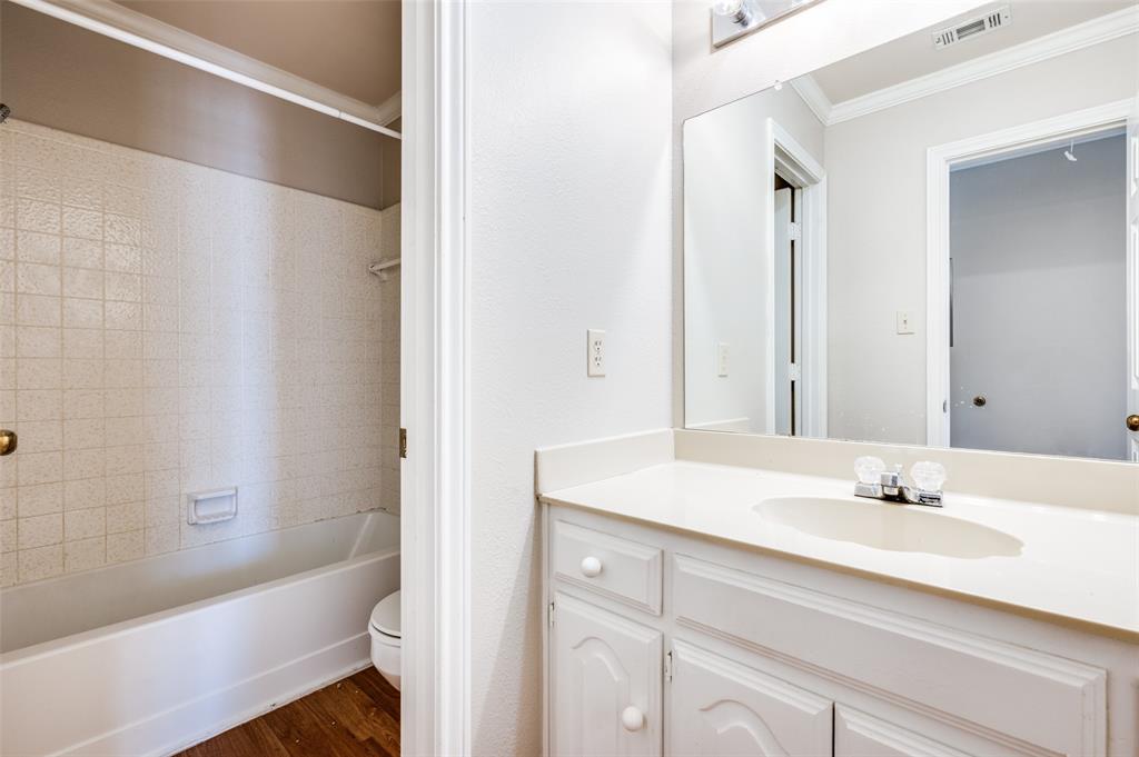 148 Cobblestone Row Denton, TX 76207 - Photo 20 of 33 Directly to the left once you reach the upstairs landing, this bathroom contains a separate, private toilet and shower area.