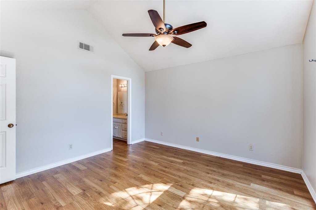 148 Cobblestone Row Denton, TX 76207 - Photo 20 of 37 The primary bedroom also contains an ensuite bathroom.