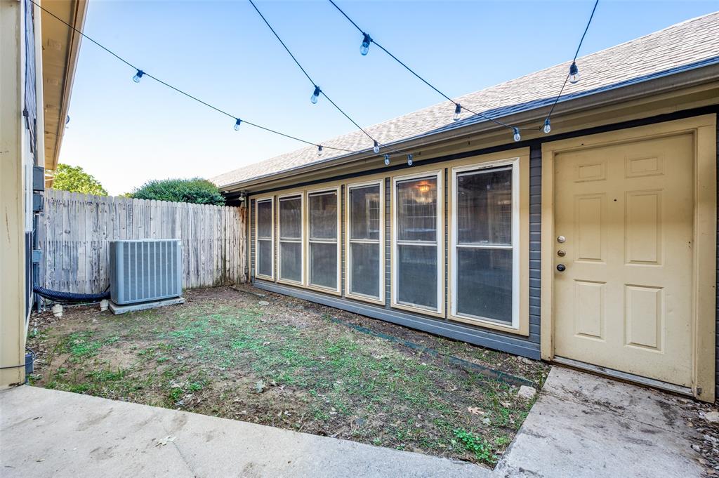 148 Cobblestone Row Denton, TX 76207 - Photo 26 of 33 The backyard features a back patio and a small grass area protected by a privacy fence. This grassy area is perfect for small pets!