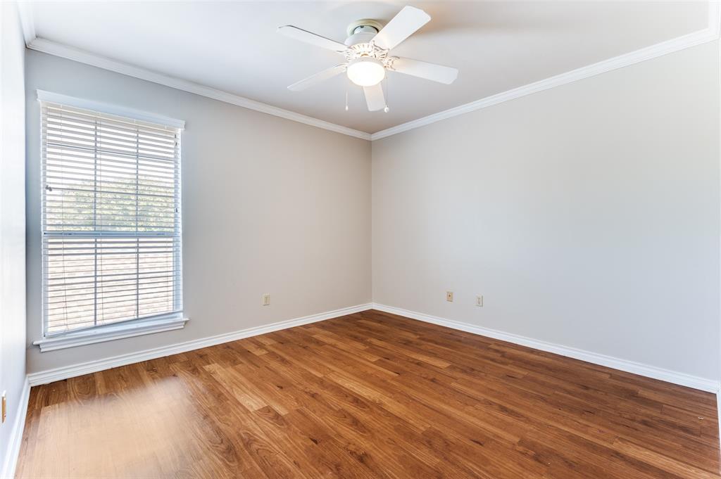 148 Cobblestone Row Denton, TX 76207 - Photo 27 of 37 wooden floor in an empty room with a window