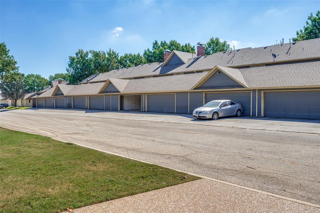 148 Cobblestone Row Denton, TX 76207 - Photo 29 of 33 This photo is taken from the entrance to the community pool. The open garage door shows how close of a walk it is from the house to the community pool.