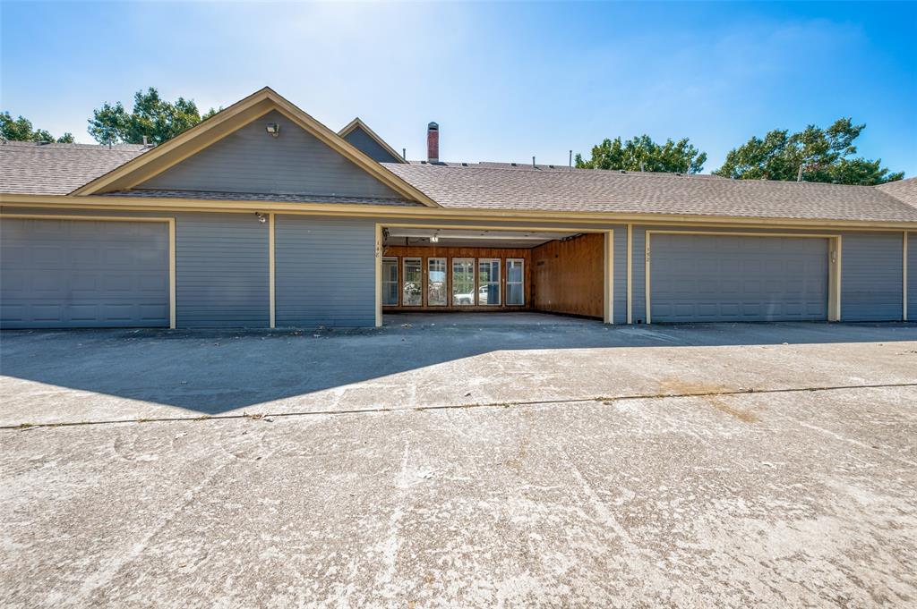 148 Cobblestone Row Denton, TX 76207 - Photo 32 of 37 This driveway leads to the garage, which can also be accessed through the back yard.