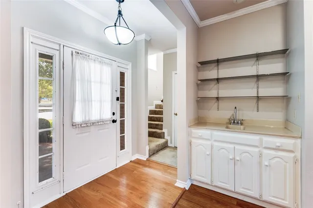 a kitchen with a refrigerator and cabinets