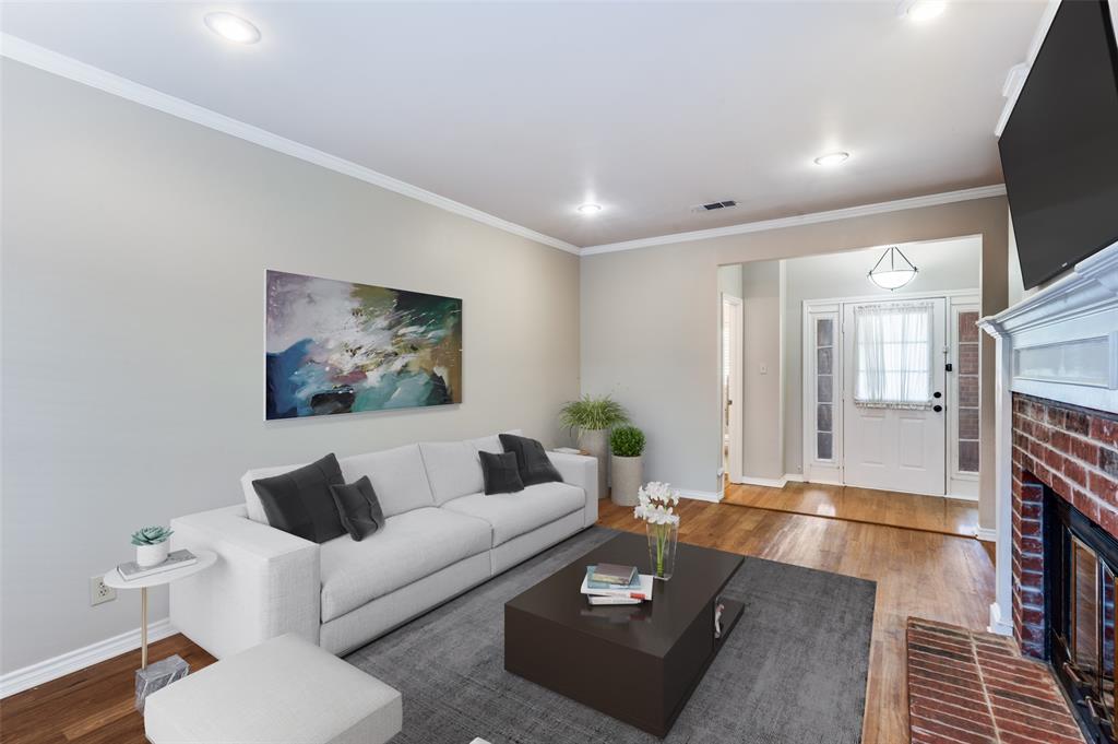 148 Cobblestone Row Denton, TX 76207 - Photo 8 of 37 a living room with furniture and a fireplace