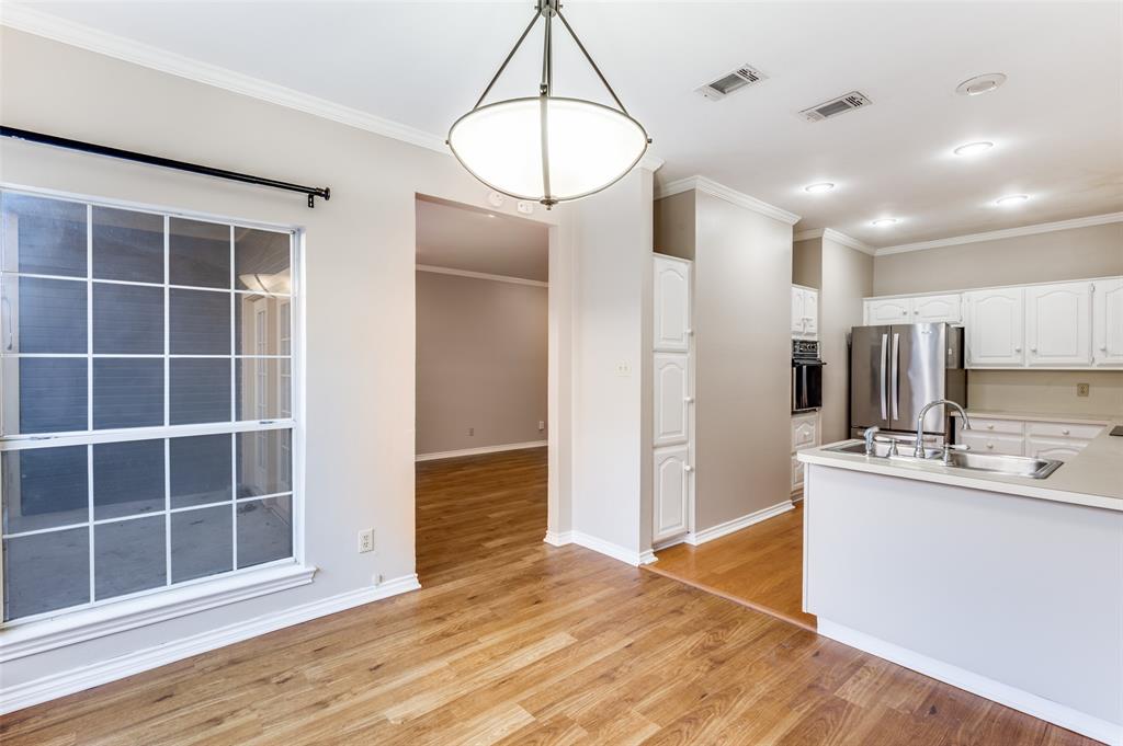 148 Cobblestone Row Denton, TX 76207 - Photo 10 of 33 The dining room also has easy access to both the living room and the kitchen.