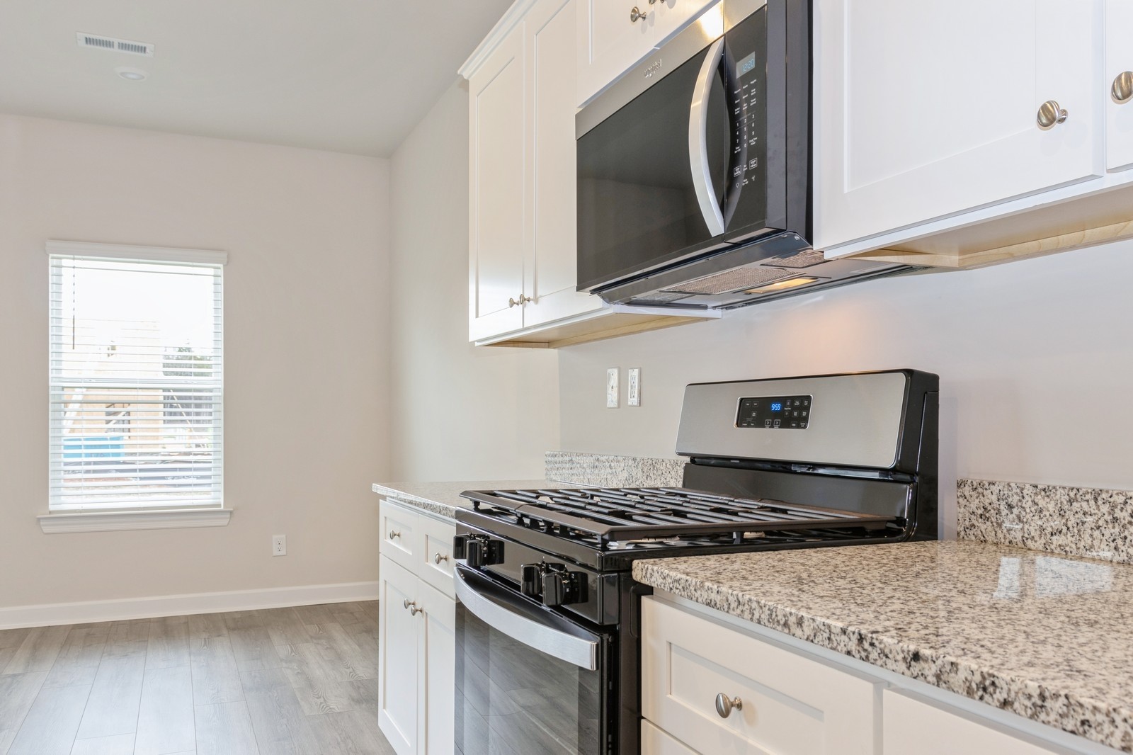 2330 Nabali Way Murfreesboro, TN 37127 - Photo 19 of 28 a kitchen with granite countertop a stove and a microwave