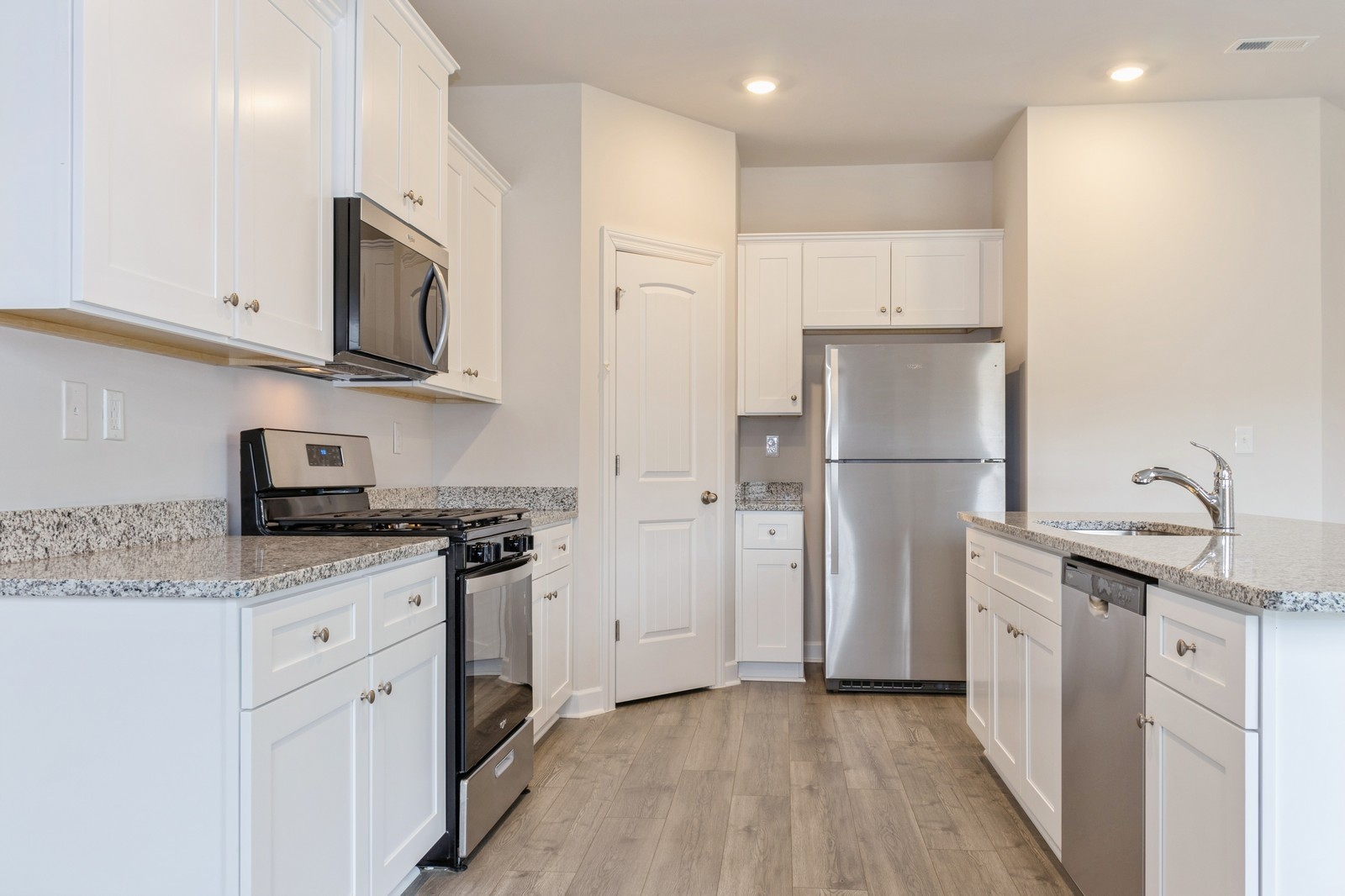 2330 Nabali Way Murfreesboro, TN 37127 - Photo 21 of 28 a kitchen with stainless steel appliances granite countertop a refrigerator sink and white cabinets