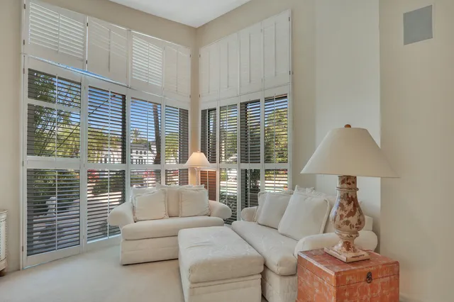 a bathroom with a sink a mirror a toilet and shower