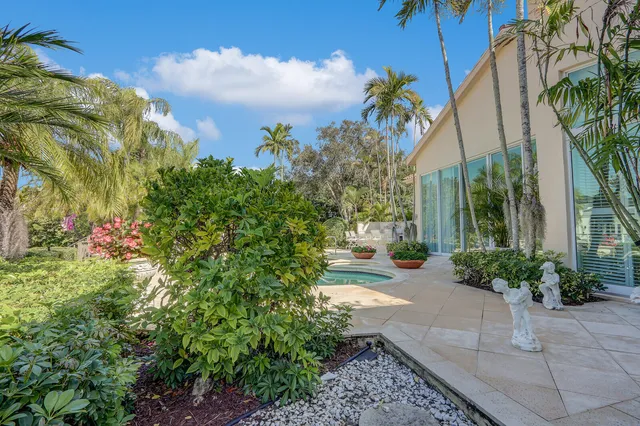 a patio with a patio table and chairs