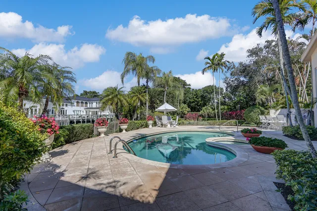 a view of a garden with an outdoor seating